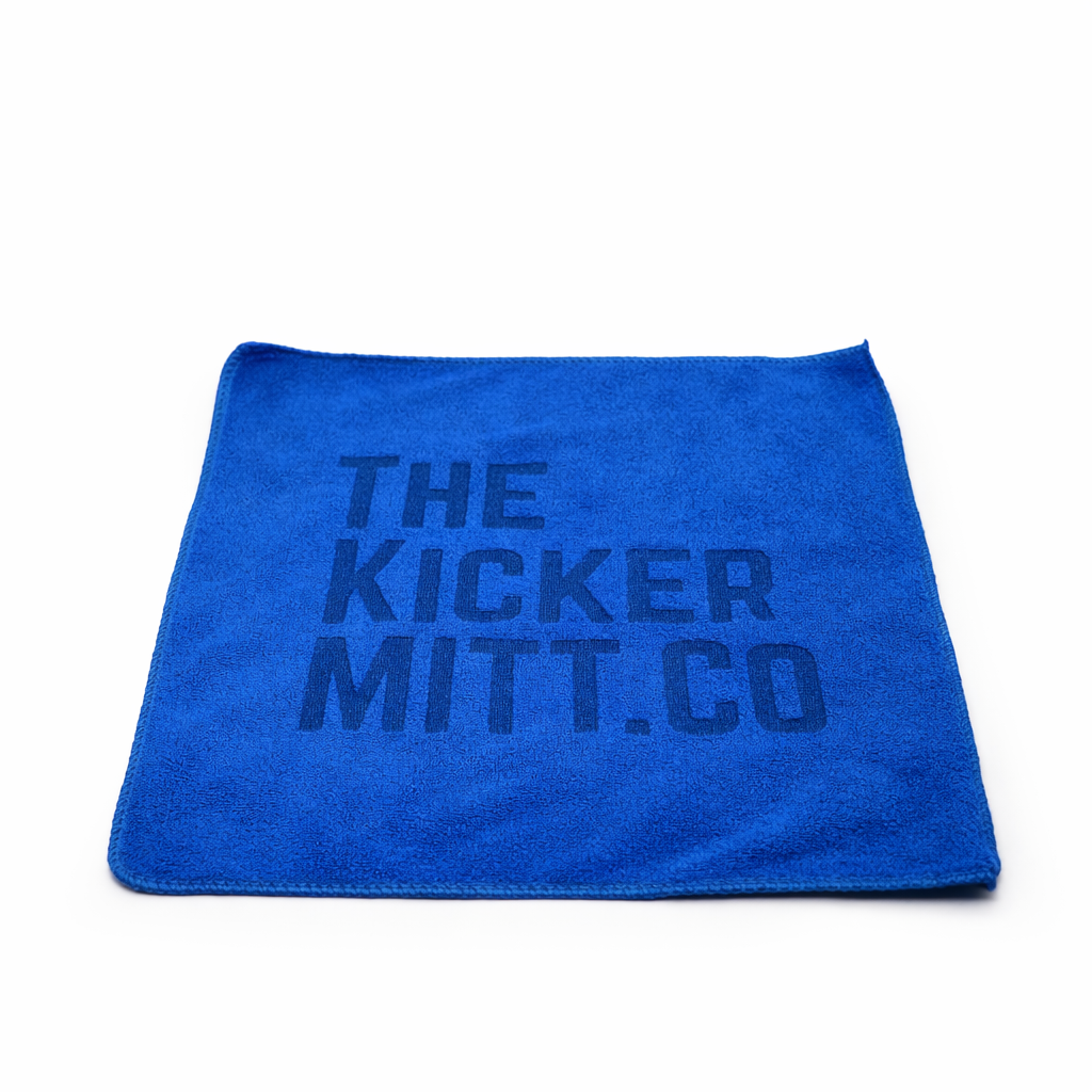Blue towel with 'The Kicker Mitt Co' text on a white background