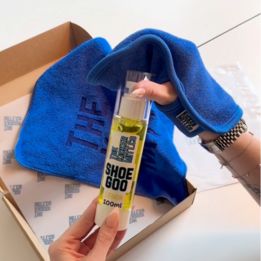 The Kicker Mitt Complete Shoe Cleaning Kit including blue mitt, branded microfibre towel, and lemon Shoe Goo cleaner in packaging